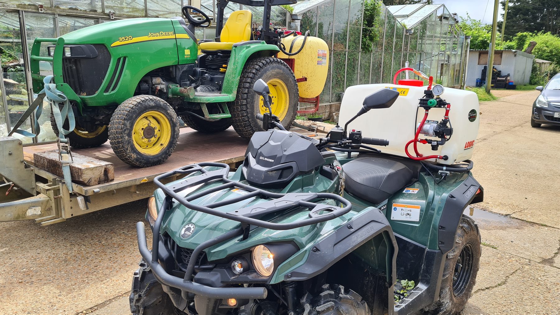 Compact tractor and sprayer equipment at the nursery