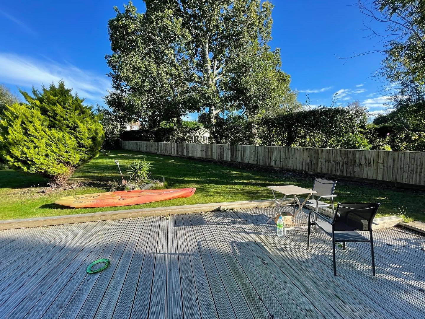 Raised timber deck and patio in a garden
