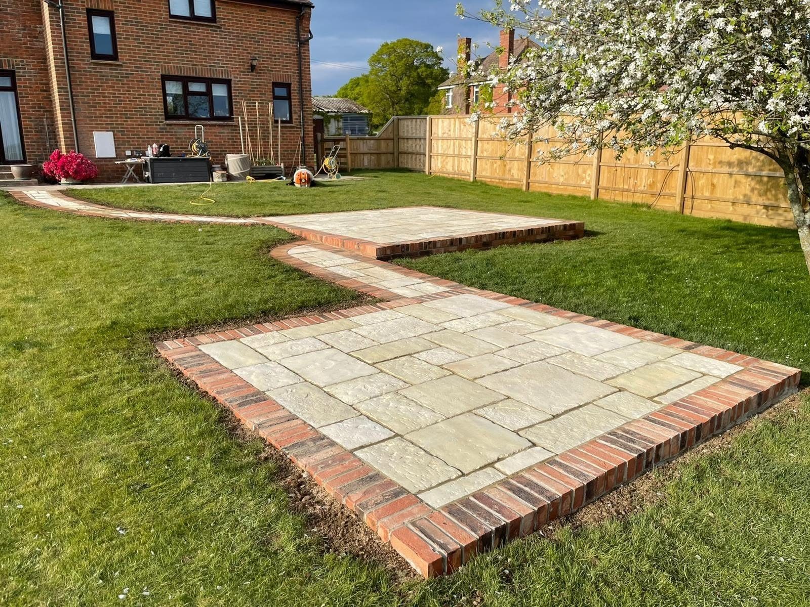 Paved patio with raised timber planters